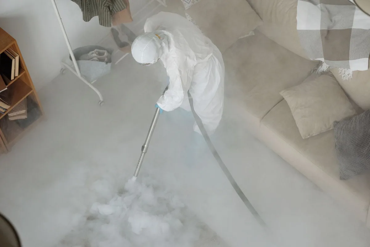 Biohazard cleanup technician in protective equipment, San Juan Bautista, CA
